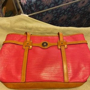 Dooney & Bourke purse. Hot pink color. Has some fading to it.